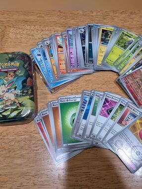 Pokemon misc card bundle 75 cards with  collectible mini tin